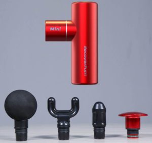 A red portable mini massage gun with various interchangeable heads displayed in front of a grey background.