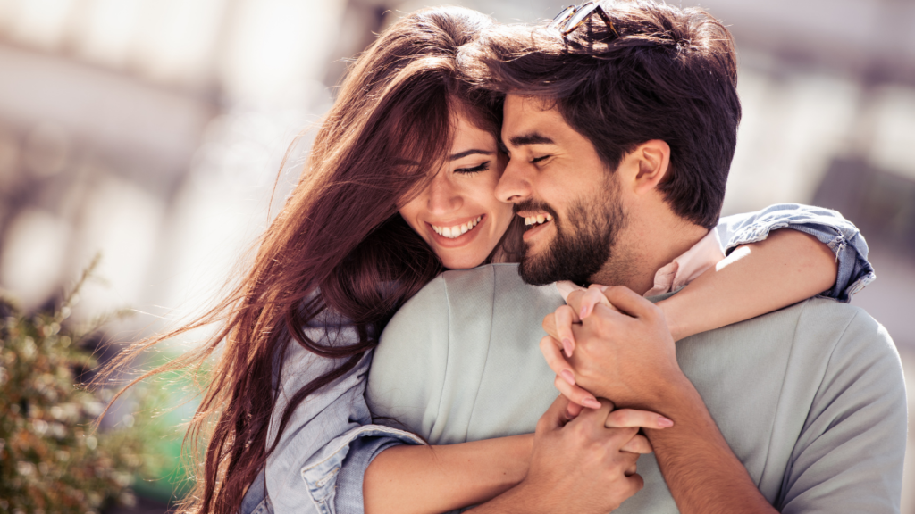 Joyful embrace: a couple shares a warm, loving hug, radiating happiness and affection.