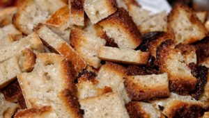 A close-up of golden-brown croutons scattered, showcasing their crispy texture and toasty edges.