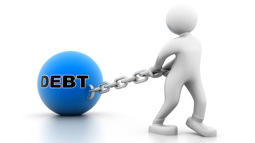 A 3D rendering of a figure shackled to a large blue ball labeled "debt," representing the burden and depression of financial obligations.