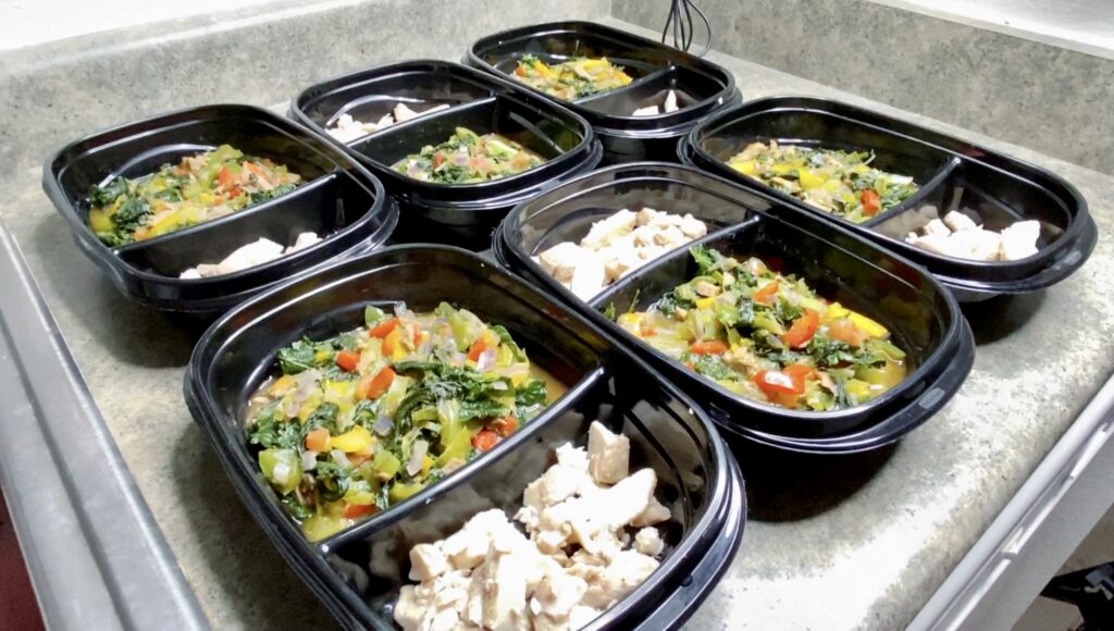 Meal prep done right: a week's worth of healthy, colorful veggie and chicken meals ready to fuel the body.